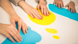 People holding different colored message bubbles