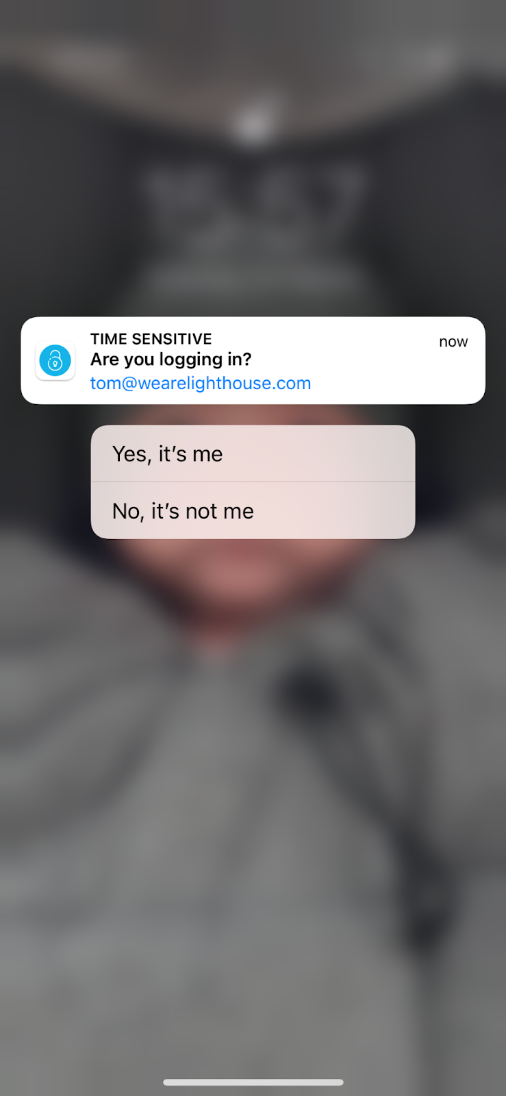 A mobile screen which asks 'are you logging in?' and is labelled 'time sensitive'. The two answer options are 'yes, it's me' or 'no, it's not me'